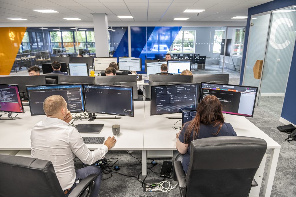 New office space with several screens and desks