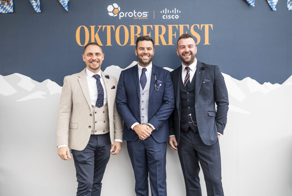 Darren, Damien and Joe at Chester Races infront of the Oktoberfest sign