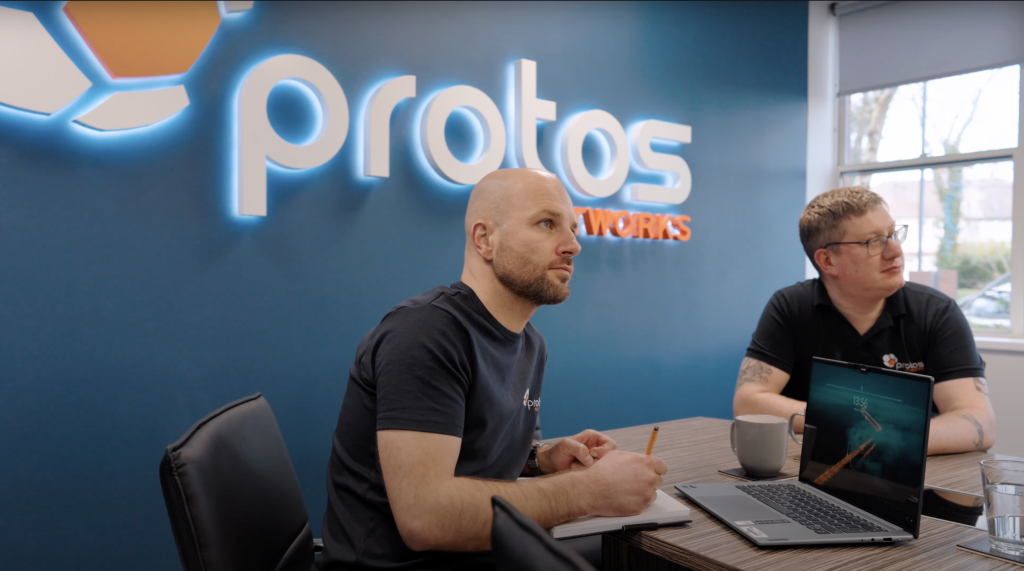 2 Team Members listening to meeting